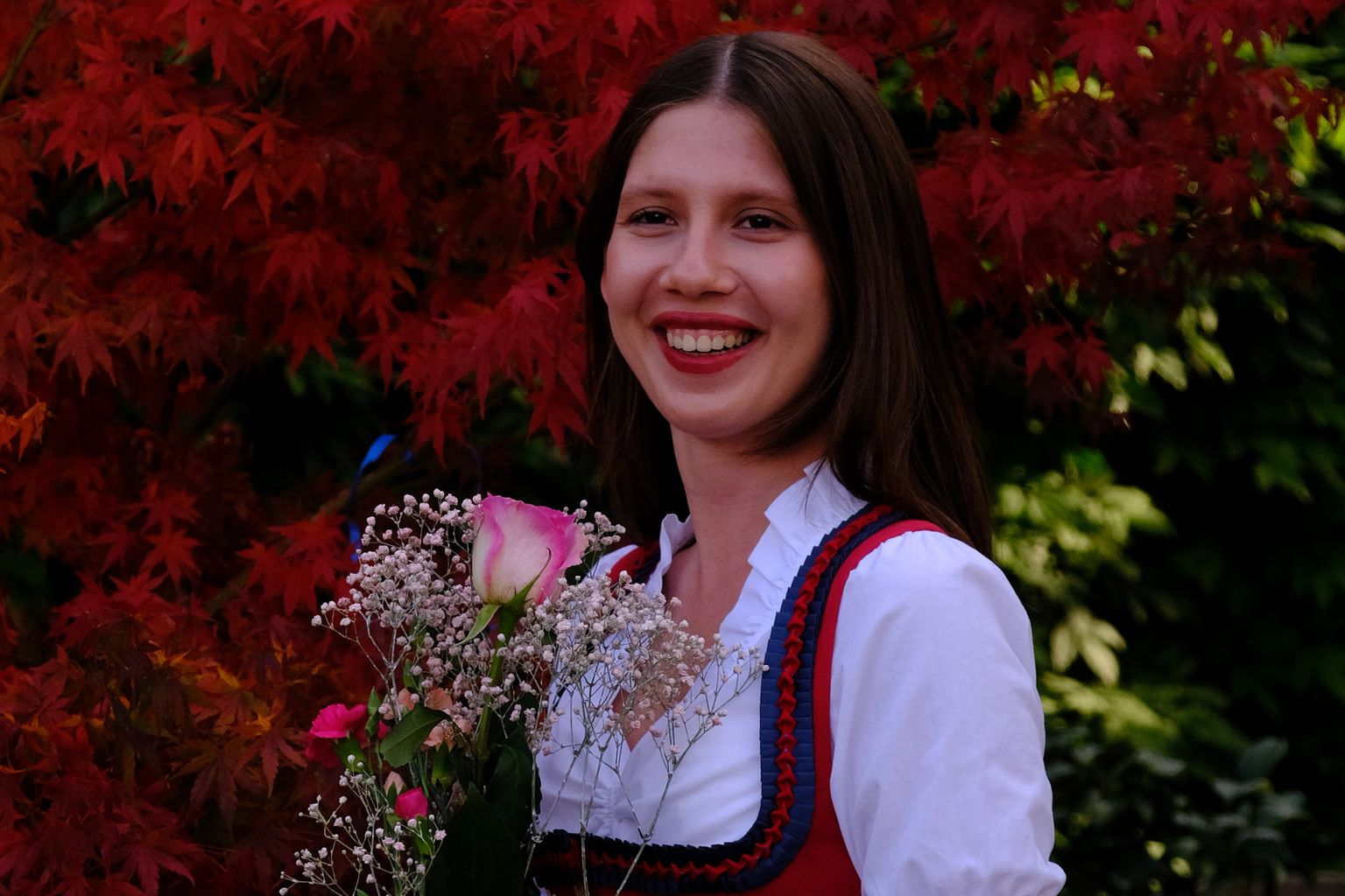 dirndl outfit for women in an autumn garden